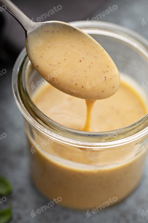 Preview: Homemade honey mustard sauce in a glass jar