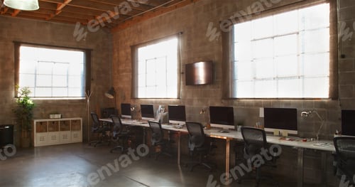 Preview: Empty Interior Of Modern Open Plan Design Office With Row Of Computers On Desk