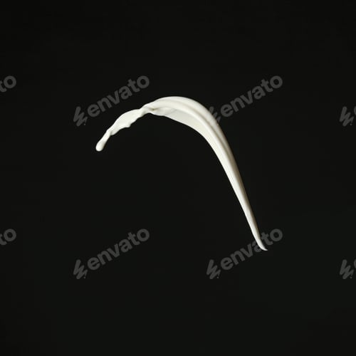 Preview: Splash of fresh milk on black background
