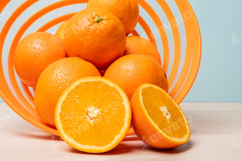 Preview: Closeup shot of freshly sliced oranges on a spiral bowl