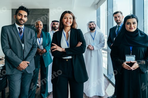 Preview: Diverse corporate business team collaborating in a dubai office