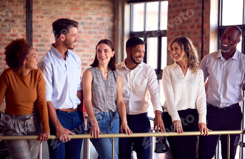 Preview: Portrait Of Multi-Cultural Business Team Meeting In Busy Office