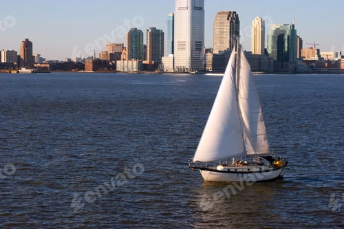 Preview: Boat in the Hudson River and buildings of New York City in the USA during daytime