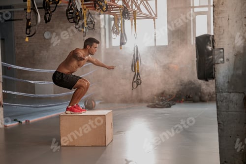 Preview: Strong muscular male working out in gym