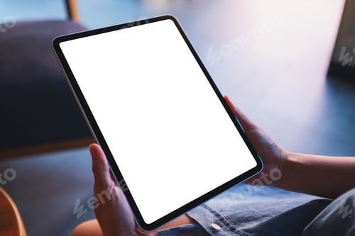 Preview: Mockup image of a woman holding digital tablet with blank white desktop screen in cafe