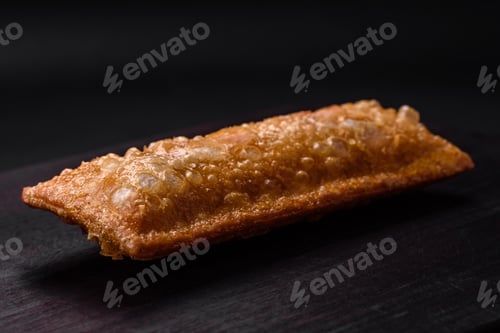 Preview: Delicious fresh crispy pie with cherry jam on a wooden cutting board