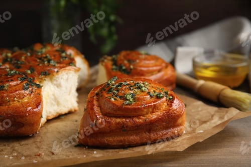 Preview: Traditional Ukrainian bread (Pampushky) with garlic on wooden table