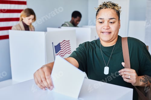 Preview: Black Woman Putting Voting Ballot in Bin