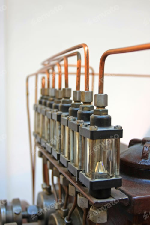 Preview: Copper Tubes Leading Into Glass Containers