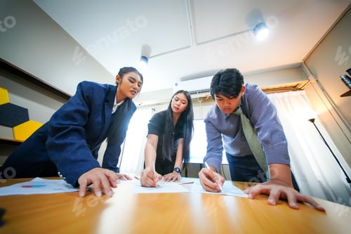 Preview: Team collaborates on project while brainstorming ideas in a modern office setting