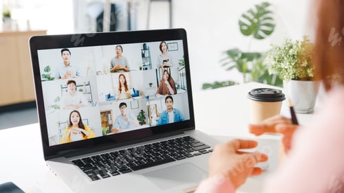Preview: Young Asia businesswoman using laptop talk to colleague in video call meeting at living room.