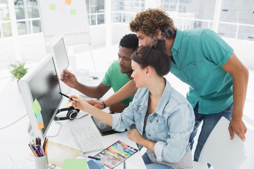 Preview: Side View Of Three Artists Working On Computer At The Office