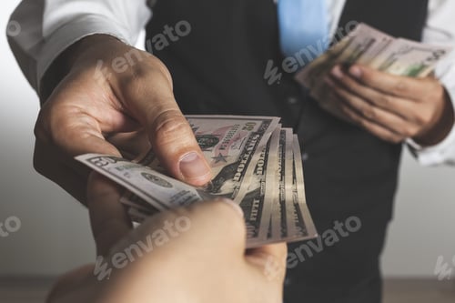 Preview: Closeup shot of a businessman giving money to another hand, doing exchanging