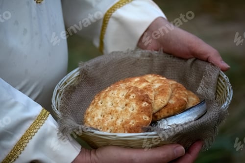 Preview: Christianity, religion, Bible concept. Five loaves of bread and two fish