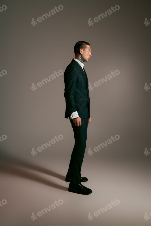 Preview: Handsome man showcases modern fashion in stylish attire with elegant confidence