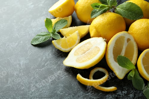 Preview: Ripe lemons on black smokey background, space for text