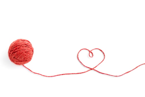 Preview: Wool ball and thread in shape of heart isolated on white background