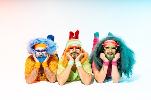 Preview: Vibrant happy Drag Queens in Retro 80s Sportswear Strike a Pose On The Floor During a Studio Session