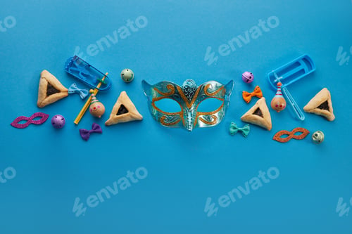 Preview: Purim celebration concept. Jewish carnival background. hamantaschen or hamans ears cookies, carnival