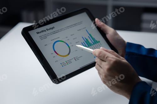Preview: Analyzing Monthly Budget on a Digital Tablet
