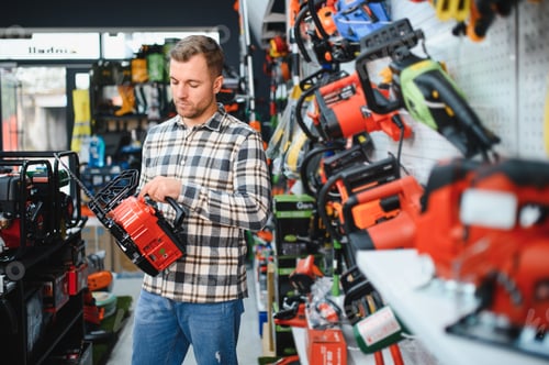 Preview: A man in a hardware store choosing a tool