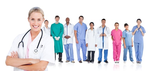 Preview: Smiling Doctor Standing In Front Of Her Medical Team In Line On White Background