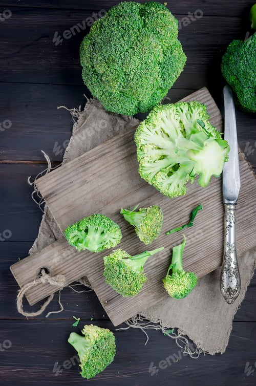 Preview: Pieces of broccoli, rustic style, old wooden background