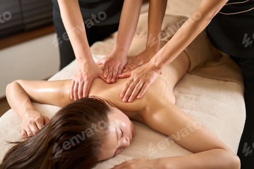 Preview: Woman receiving back massage at beauty salon