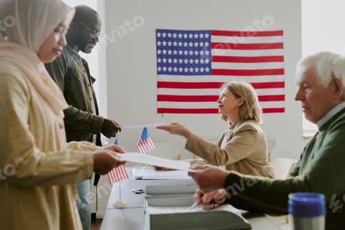 Preview: Voting Station Workers Giving Papers To Citizens