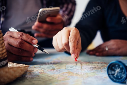 Preview: Travelers are planning a trip by searching the route on the map and searching