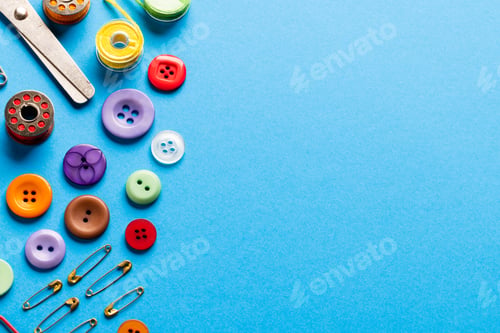 Preview: Composition of sewing equipment on blue background