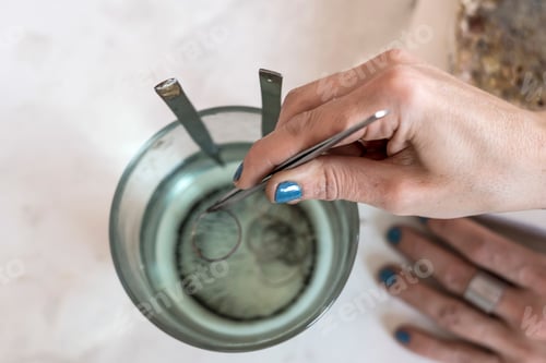 Preview: Woman Working on Craft with Tweezers