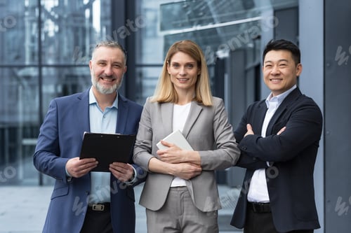 Preview: Successful dream team, diverse business group of asian man and business woman smiling and looking at