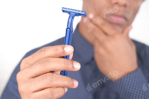 Preview: man holding Razor isolated on white