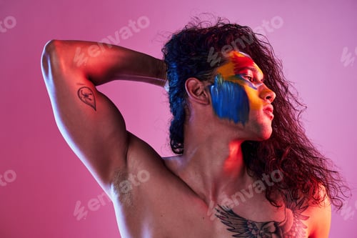Preview: Creative, face paint and art with man in studio for beauty, self love and designer. Fantasy, neon a