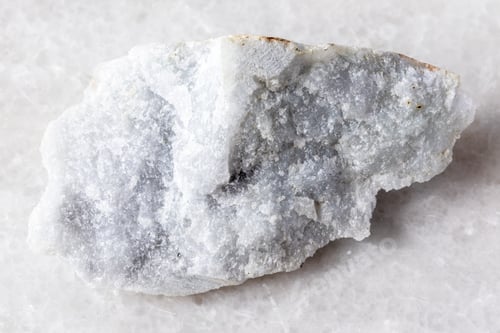 Preview: sample of raw jadeite rock on white marble
