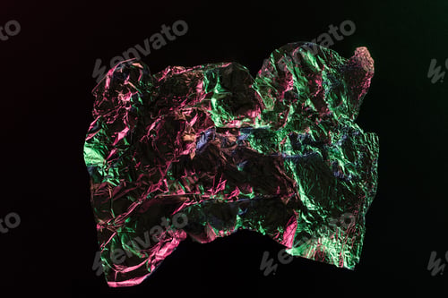 Preview: top view of crumpled foil with colorful lighting reflection in darkness isolated on black