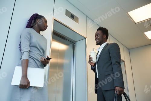 Preview: Business People Waiting for Elevator in Office
