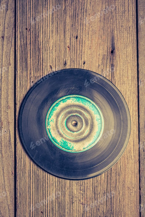 Preview: Blue and black scratched vinyls on wooden table