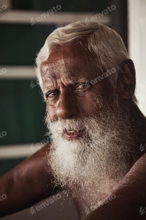 Preview: The face of an old Asian elderly man with a gray beard