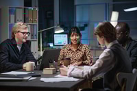 Preview: Business people sitting at meeting till late evening