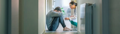 Preview: Psychiatrist talking to patient with mental disorder and suicidal thoughts sitting on room floor