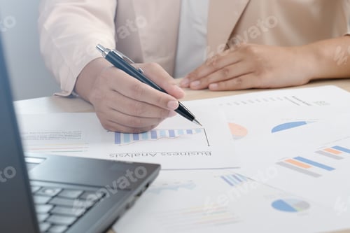 Preview: Business woman working for budget or report graph document paper on desk