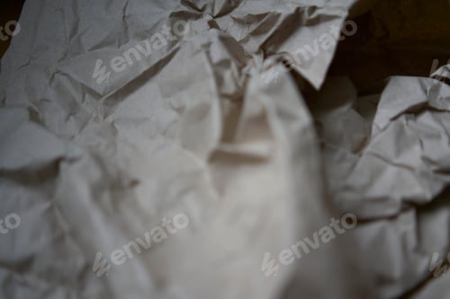 Preview: Crumpled brown kraft paper texture with rough fold