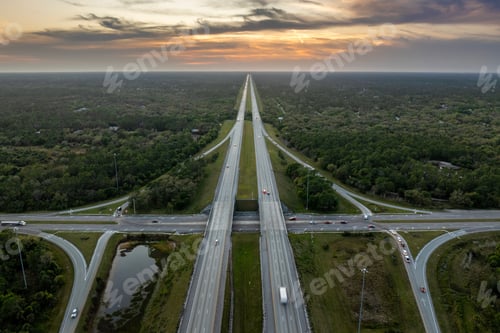 Preview: Elevated view of freeway exit junction over road lanes