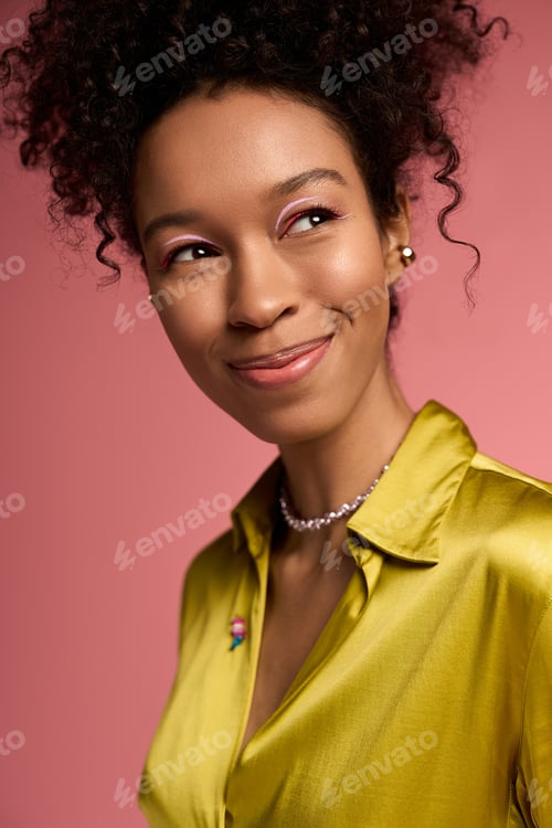 Preview: Young beautiful woman smiling with joy against a vibrant pink backdrop showcasing her charm