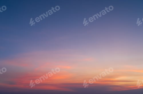 Preview: Sunset sky. Abstract nature background. Dramatic blue and orange, colorful clouds at twilight time.
