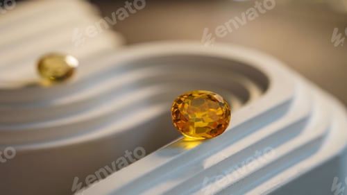 Preview: Closeup of natural imperial topaz gems on a white spiral