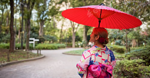 Preview: Kimono, umbrella and walking with woman in park to explore green location for sightseeing or touris