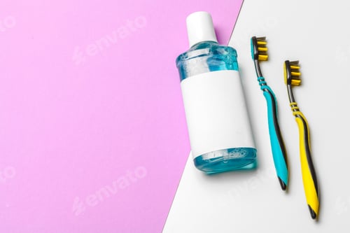 Preview: Flat lay composition with manual toothbrushes and oral hygiene product. creative photo.